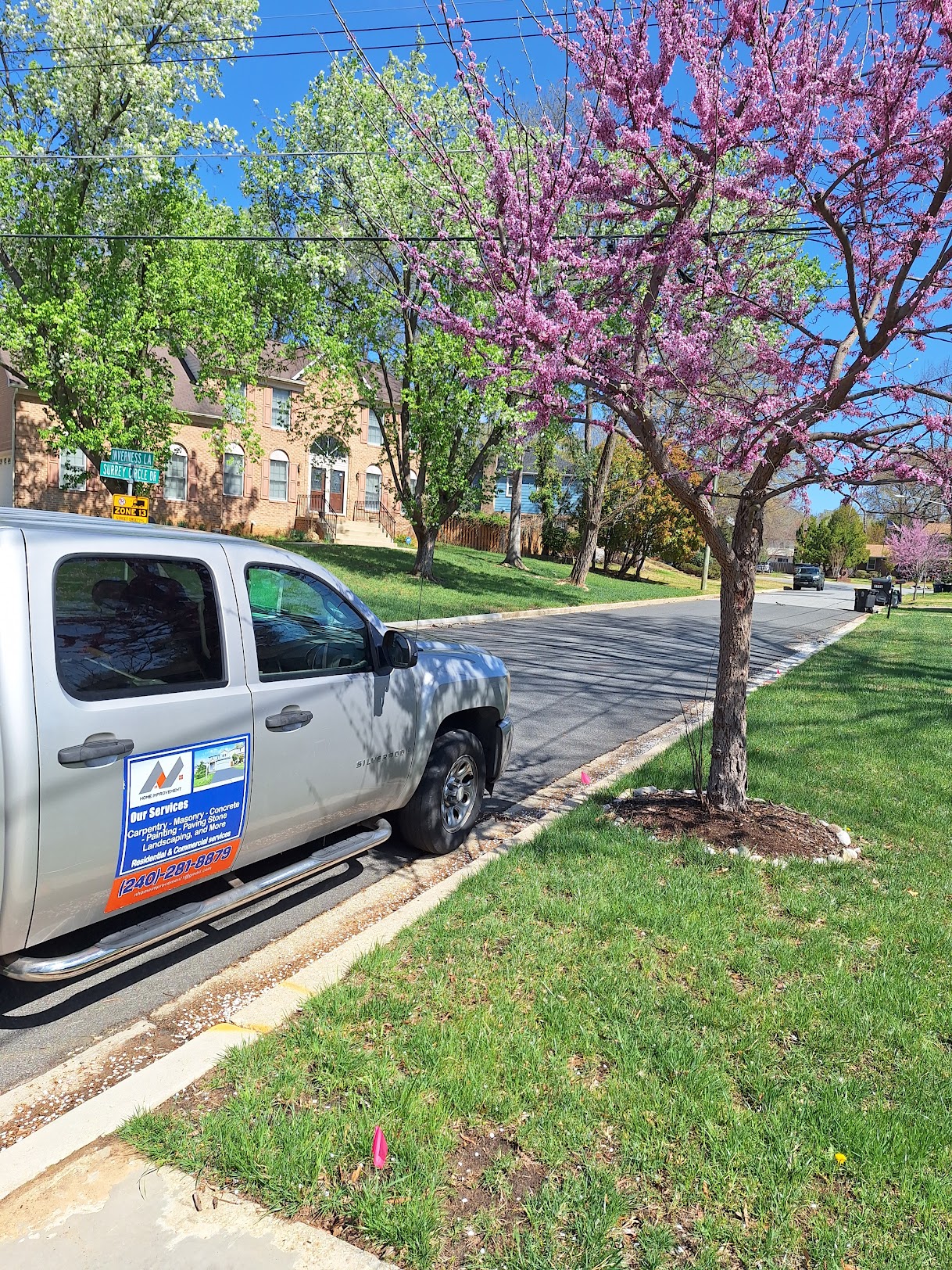 nhomeimprovement service truck parked in a residential neighborhood